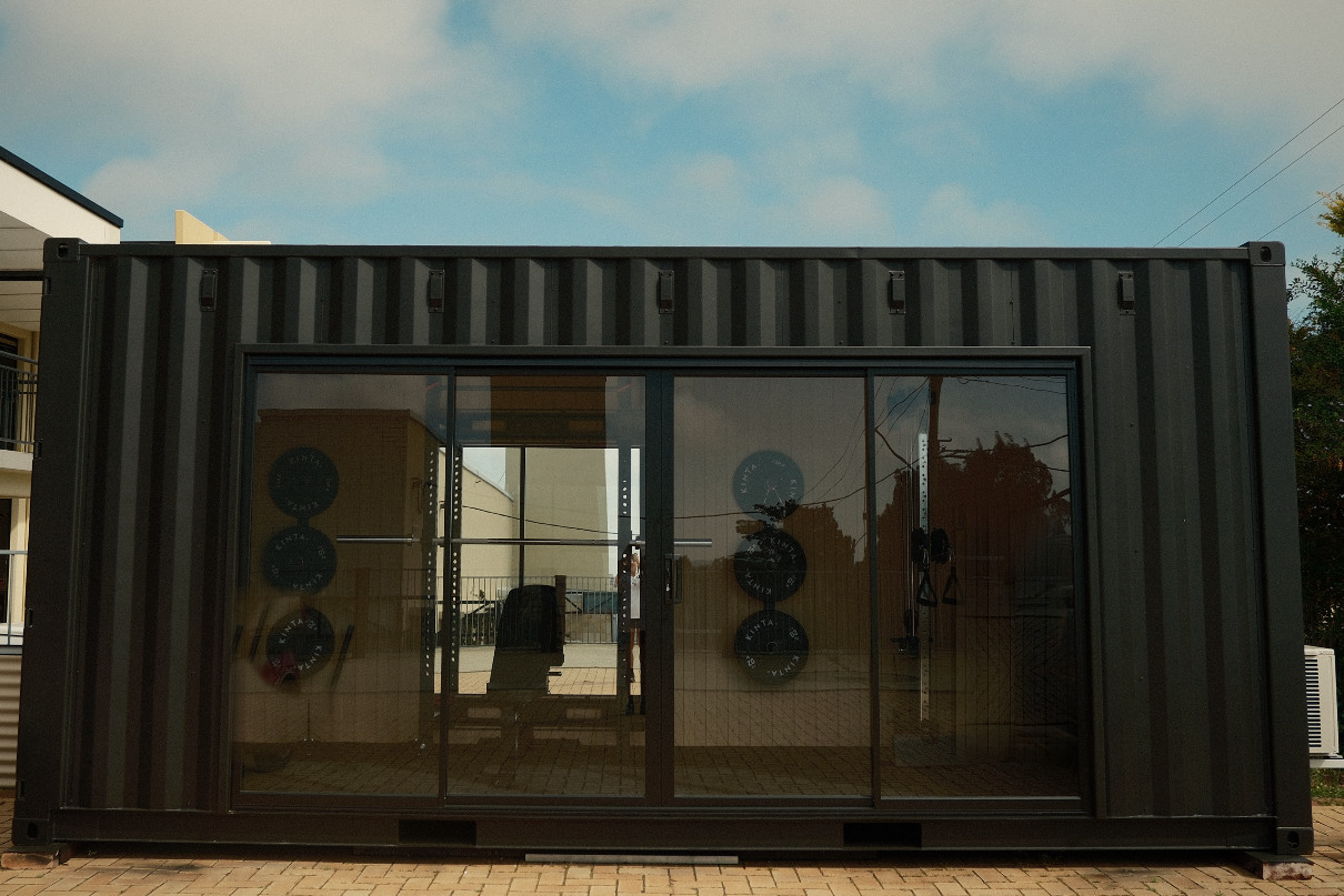 A crgo unit in place, sliding doors closed, brick paving in front